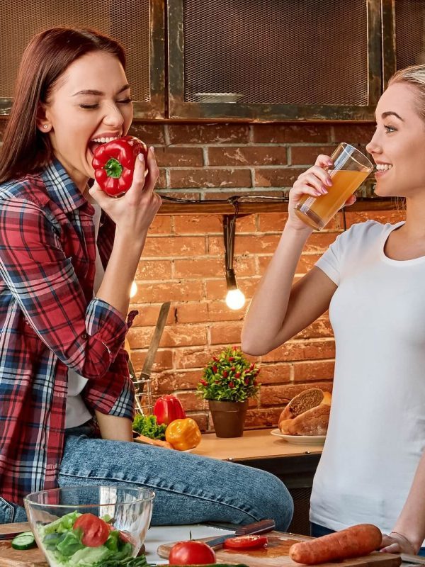 eat-well-to-be-well-young-female-friends-preparing-together-healthy-meal-in-modern-kitchen-cozy-1-q54ctzwn2c609y1q3ga670us61s0hbnqqhecrjxkjk